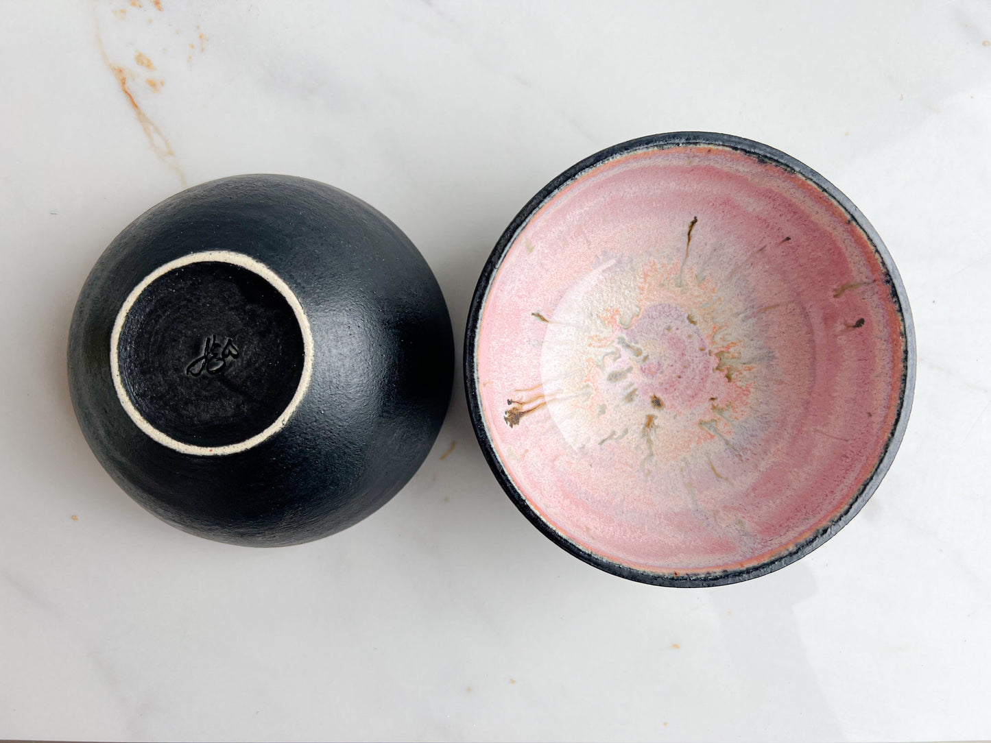 small pink and black bowl