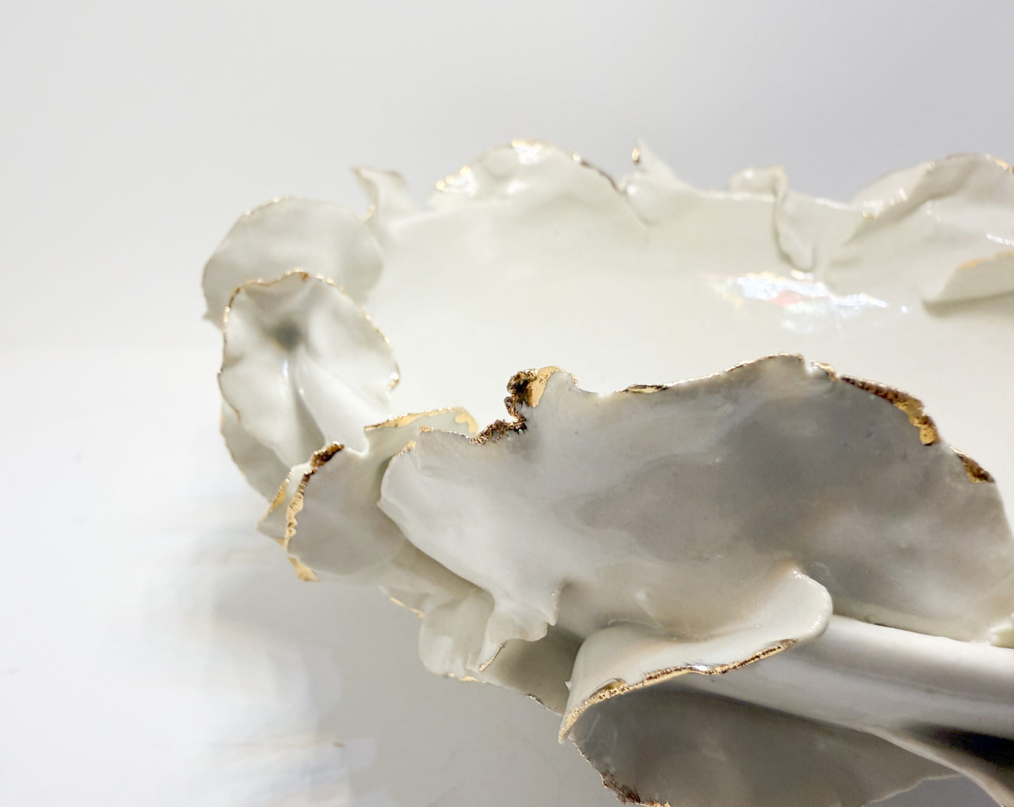 Shallow gold rimmmed ruffle bowl