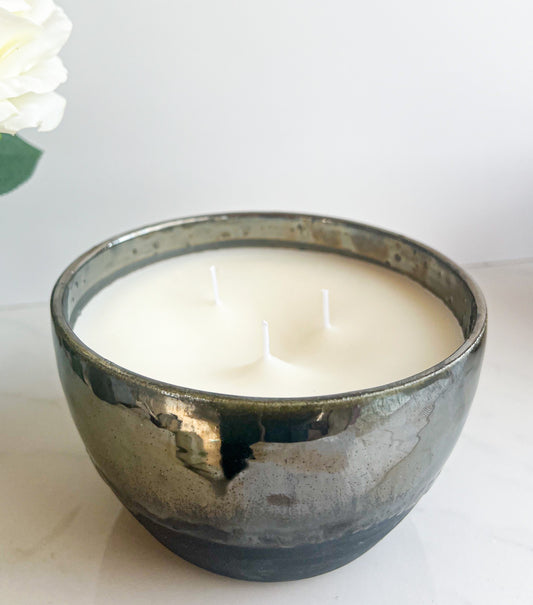 curved black matte and metallic candle