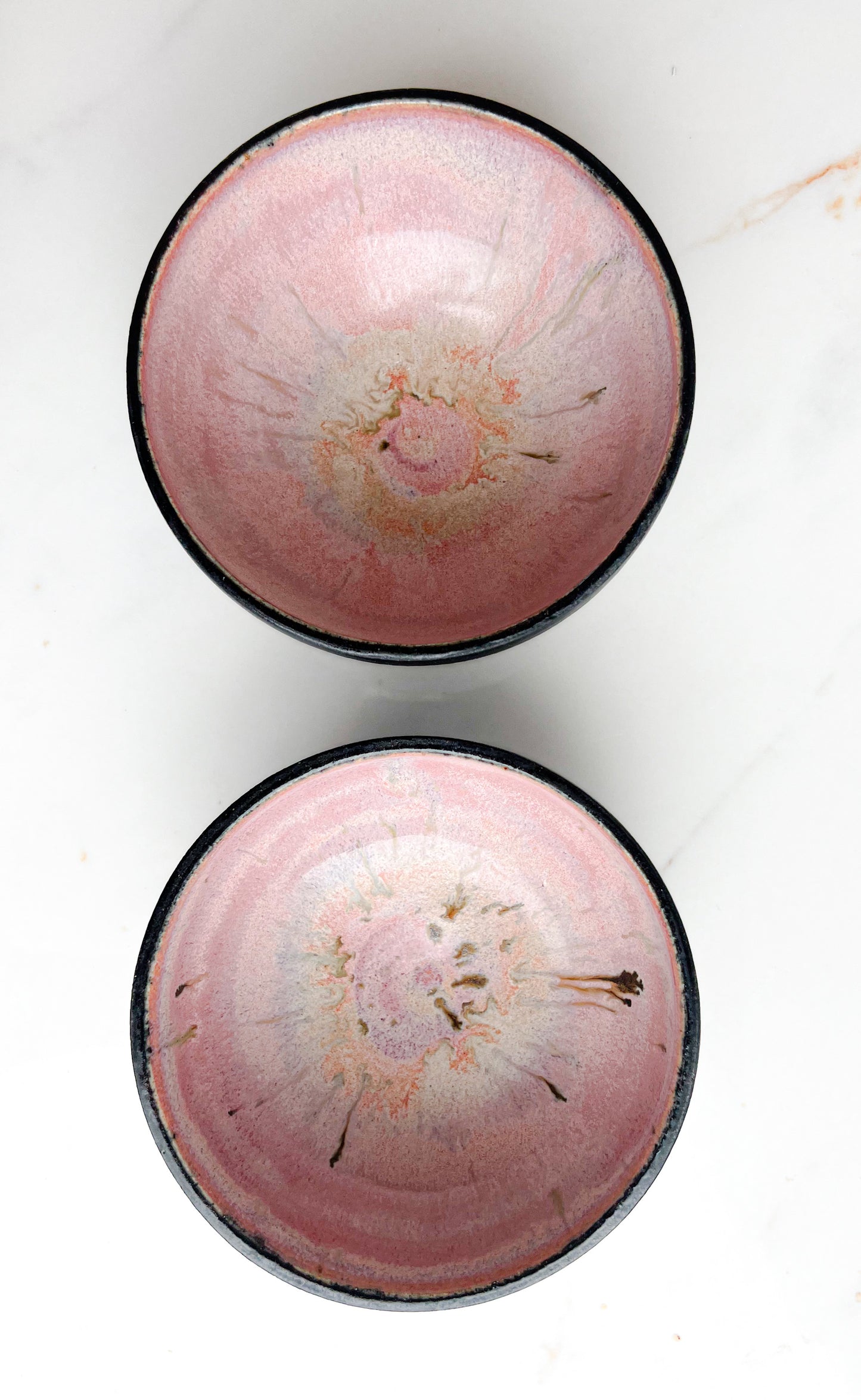 small pink and black bowl