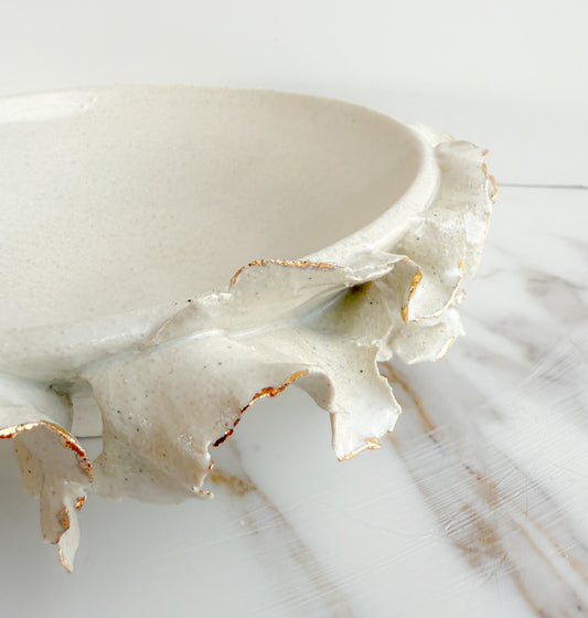 Shallow gold rimmmed ruffle bowl