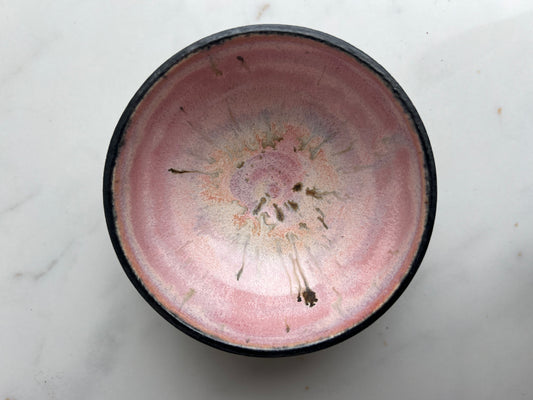 small pink and black bowl